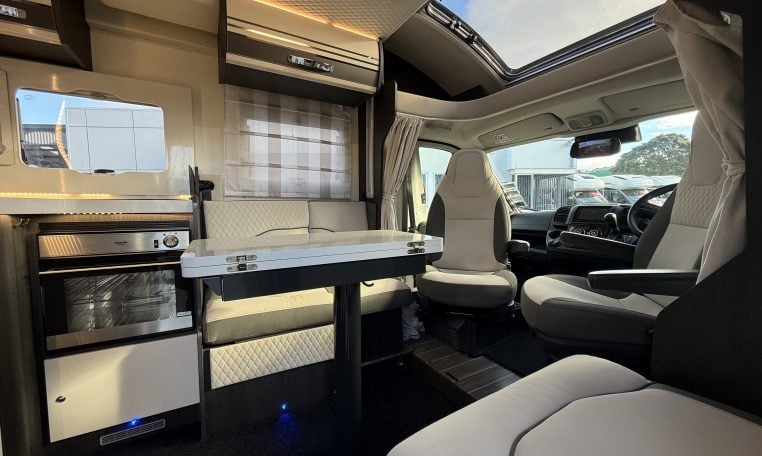 2022 Ci Magis 66XT interior view of the spacious front dining area with comfortable seating.