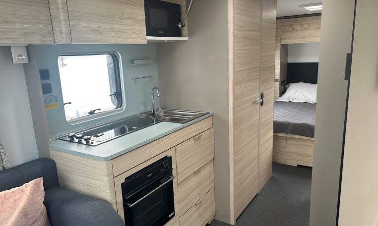 2023 Adria Altea Dart caravan interior view with built-in oven.