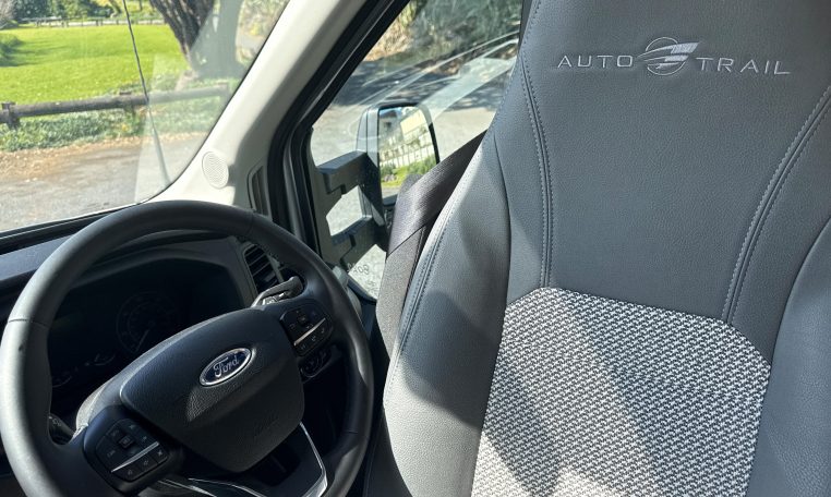 2023 Auto-Trail F72 4-berth motorhome interior view showing the steering wheel and driver seat.