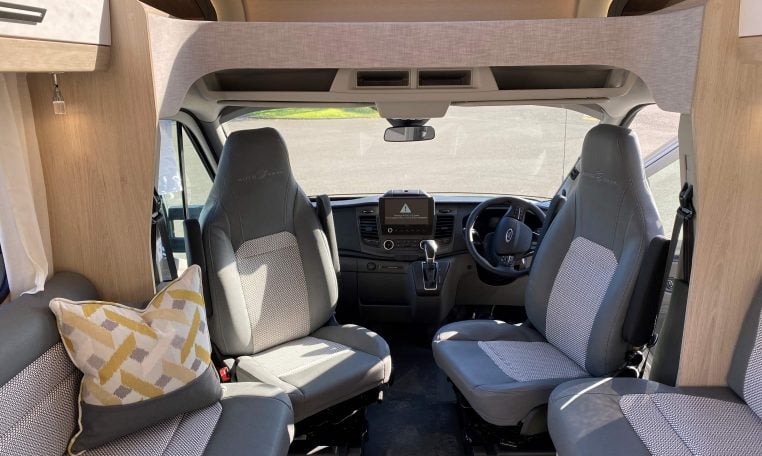 2023 Auto-Trail F74 interior view showing the front captain swivel chairs.