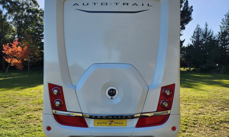 2023 Auto-Trail Frontier Comanche exterior view showing the rear side of the motorhome.