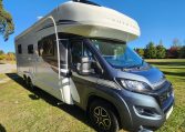 2023 Auto-Trail Frontier Comanche exterior view showing the driver's side and front of the motorhome.