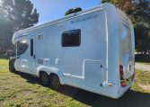 2023 Auto-Trail Frontier Comanche exterior view showing the habitation door and side of motorhome.