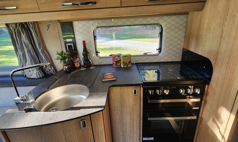 2023 Auto-Trail Frontier Comanche interior view showing the compact motorhome kitchen.