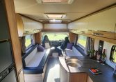 2023 Auto-Trail Frontier Comanche interior view of the overhead storage in the front lounge.