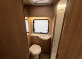 2023 Auto-Trail Imala 730 motorhome interior view showing the clean and compact bathroom.