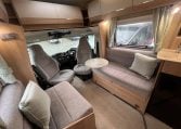 2023 Auto-Trail Imala 730 motorhome interior view showing the comfortable bench seats.