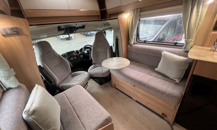 2023 Auto-Trail Imala 730 motorhome interior view showing the comfortable bench seats.