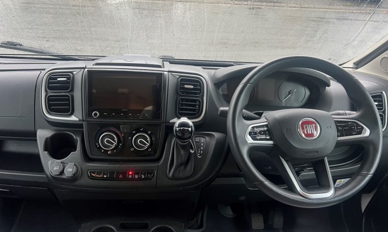 2023 Auto-Trail Imala 730 motorhome interior view showing the steering wheel and dash in the cab.