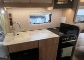 2023 Auto-Trail Imala 730 motorhome interior view showing the kitchen with ample bench space.