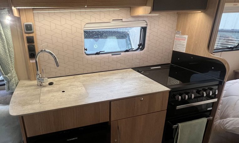 2023 Auto-Trail Imala 730 motorhome interior view showing the kitchen with ample bench space.