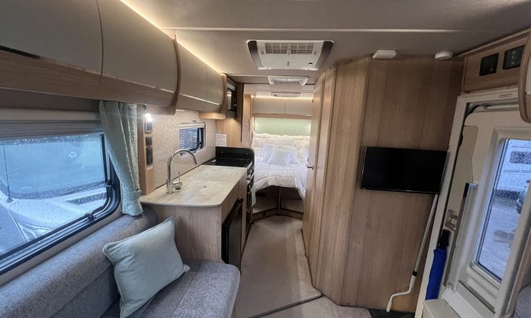 2023 Auto-Trail Imala 730 motorhome interior view showing the TV in the living room.