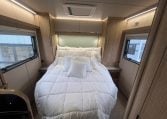 2023 Auto-Trail Imala 730 motorhome interior view showing the spacious bedroom setup with the rear island bed.