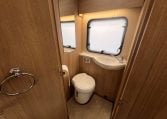 2023 Auto-Trail Imala 730 motorhome interior view showing the compact toilet.