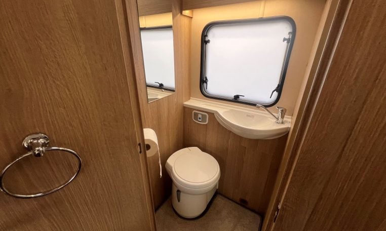 2023 Auto-Trail Imala 730 motorhome interior view showing the compact toilet.