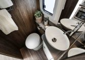 Interior view of the 2023 Roller Team Pegaso 745 bathroom with a toilet and handbasin.