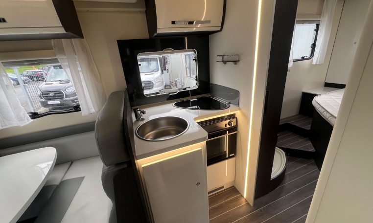 2023 Roller Team Zefiro 696 motorhome interior view showing the compact kitchen setup.