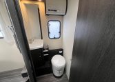 2023 Roller Team Zefiro 696 motorhome interior view showing the bathroom with a toilet and handbasin.