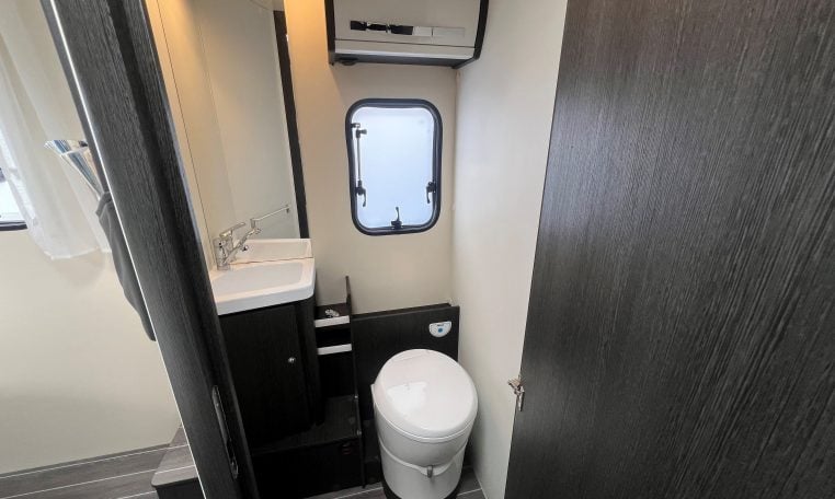 2023 Roller Team Zefiro 696 motorhome interior view showing the bathroom with a toilet and handbasin.
