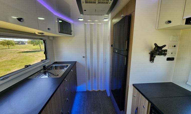 2023 Titan Blackhawk 720 Tardis interior view showing the bedroom door closed off.