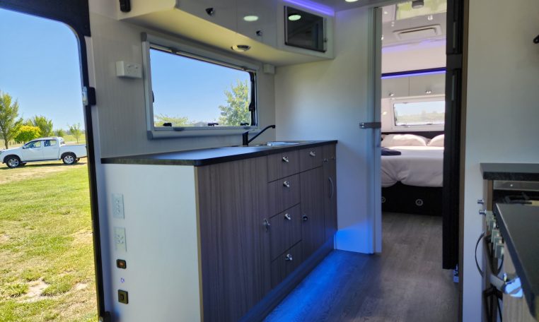 2023 Titan Blackhawk 720 Tardis caravan interior view showing the spacious kitchen.
