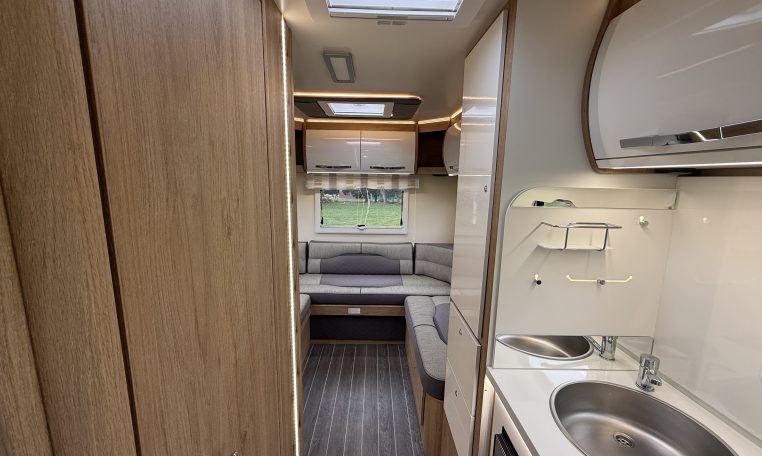 2023 Roller Team Auto-Roller 747 motorhome interior view showing the front dinette and kitchen.