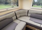 2023 Roller Team Auto-Roller 747 motorhome interior showing the corner seat of the rear lounge.