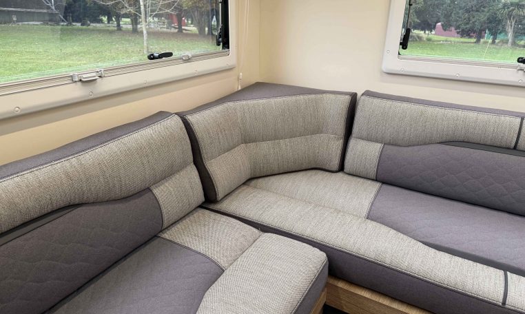 2023 Roller Team Auto-Roller 747 motorhome interior showing the corner seat of the rear lounge.