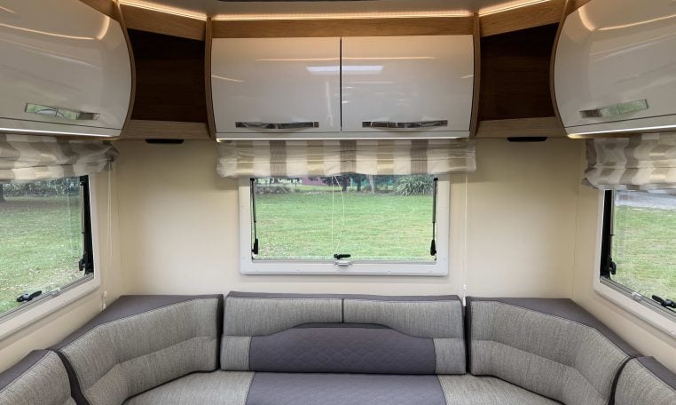 2023 Roller Team Auto-Roller 747 motorhome interior showing the rear lounge overhead storage.