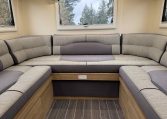 2023 Roller Team Auto-Roller 747 motorhome interior showing the rear u-shaped lounge.