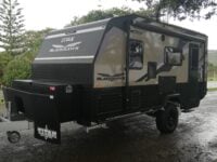 Titan Blackhawk Family 490F Bunk caravan exterior view of the front and habitation door.