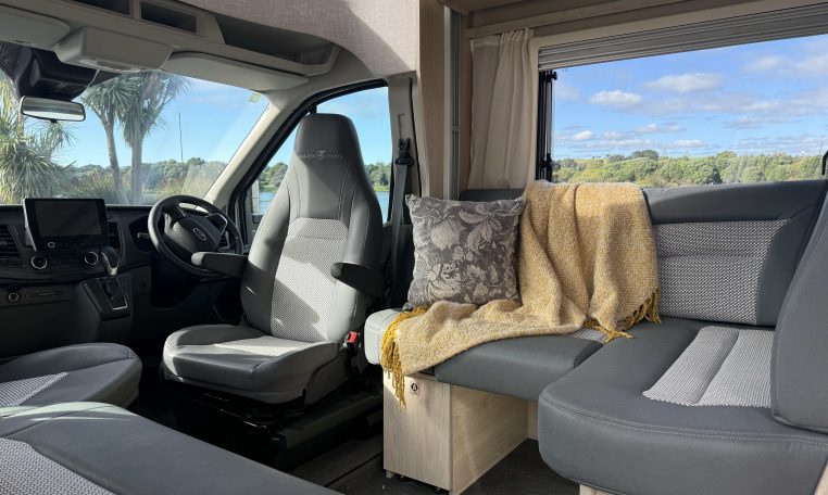 Auto-Trail F74 Motorhome front dining with electric drop-down bed