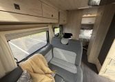 Auto-Trail F74 Motorhome front dining area with foldaway table
