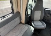 Auto-Trail F74 interior view showing the captain swivel chair with leatherette upholstery.