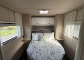 Auto-Trail F74 motorhome interior view showing the spacious bedroom with a rear island bed.