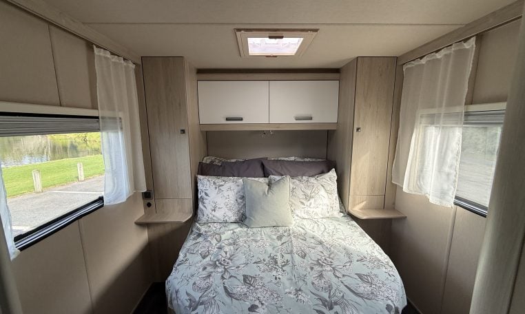 Auto-Trail F74 motorhome interior view showing the spacious bedroom with a rear island bed.