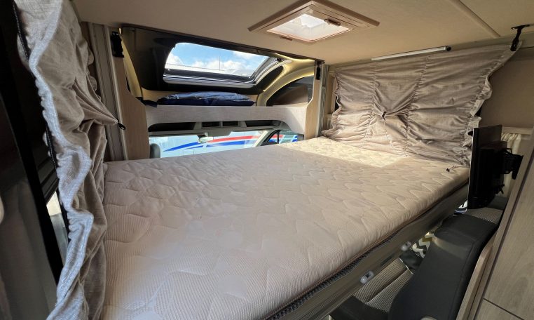 2024 Auto-Trail F-Line F62 motorhome interior view showing the drop-down bed for lowered.