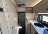 2024 Auto-Trail F-Line F62 motorhome interior view showing the large fridge and control panel above.