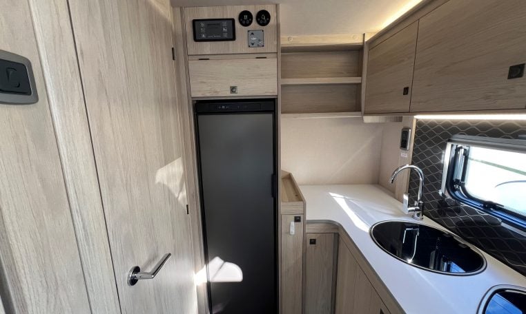 2024 Auto-Trail F-Line F62 motorhome interior view showing the large fridge and control panel above.