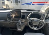 2024 Auto-Trail F-Line F62 motorhome interior view of the cab area showing the steering wheel and dashboard.