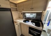 2024 Auto-Trail F-Line F62 motorhome interior view of the kitchen with stove top, oven and grill.