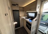 2024 Auto-Trail F-Line F62 motorhome interior view of the kitchen with overhead storage.