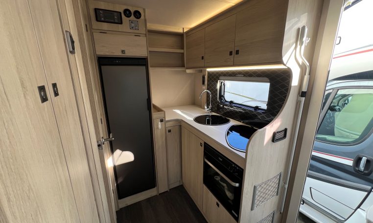 2024 Auto-Trail F-Line F62 motorhome interior view of the kitchen with overhead storage.