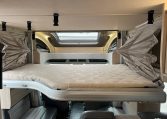 Drop-down bed inside the Auto-Trail F-Line F70 motorhome providing additional sleeping space.