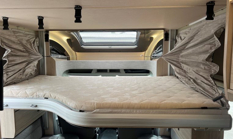 Drop-down bed inside the Auto-Trail F-Line F70 motorhome providing additional sleeping space.
