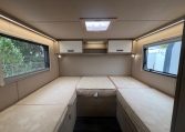 Auto-Trail F-Line F70 motorhome bedroom with twin single beds, central walkway and overhead storage for a spacious, comfortable layout.