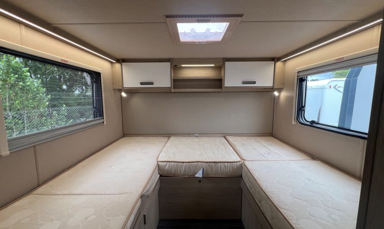 Auto-Trail F-Line F70 motorhome bedroom with twin single beds, central walkway and overhead storage for a spacious, comfortable layout.