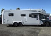 Side view of an Auto-Trail Frontier Comanche motorhome showing the driver's door.