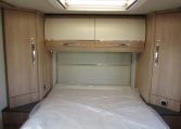 2024 Auto-Trail Frontier Comanche motorhome interior view showing the bedroom overhead storage.