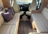 2024 Auto-Trail Frontier Comanche interior showcasing the cab swivel seats expanding the seating in the living room.